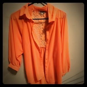 Orange button down blouse with lace back